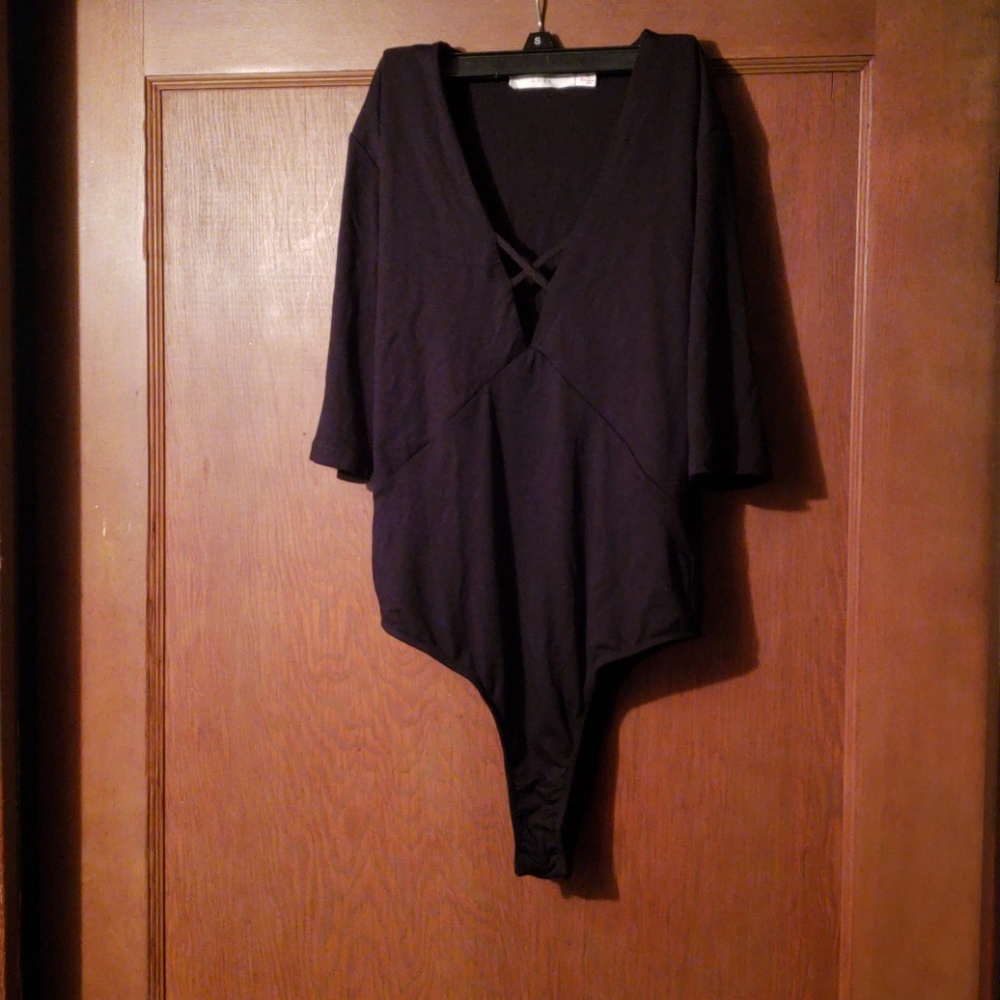 Lush black cross bodysuit